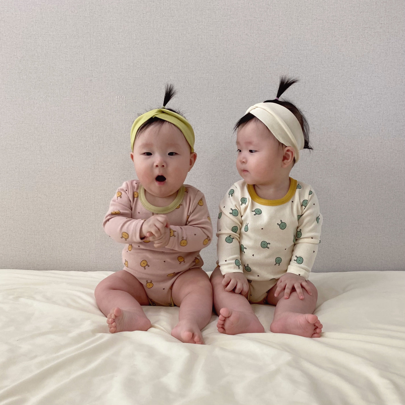 Babies wearing bunny printed long sleeve bodysuit onesie