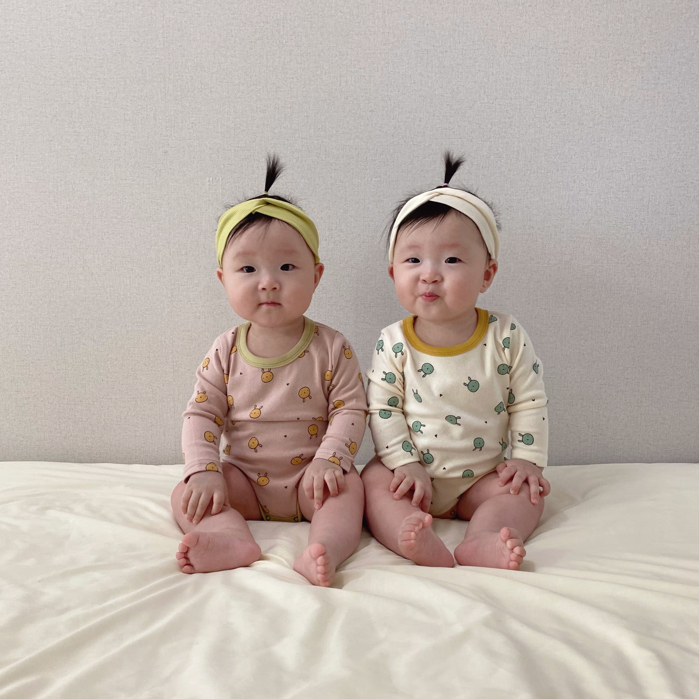 Babies wearing bunny printed long sleeve bodysuit onesie
