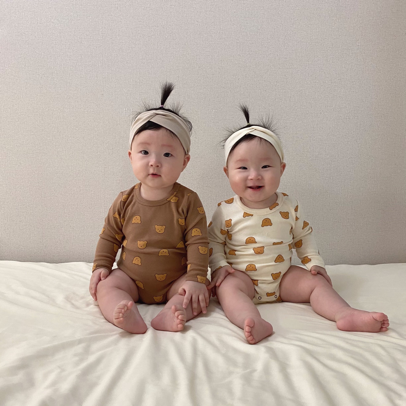 Babies wearing bear printed long sleeve bodysuit onesie