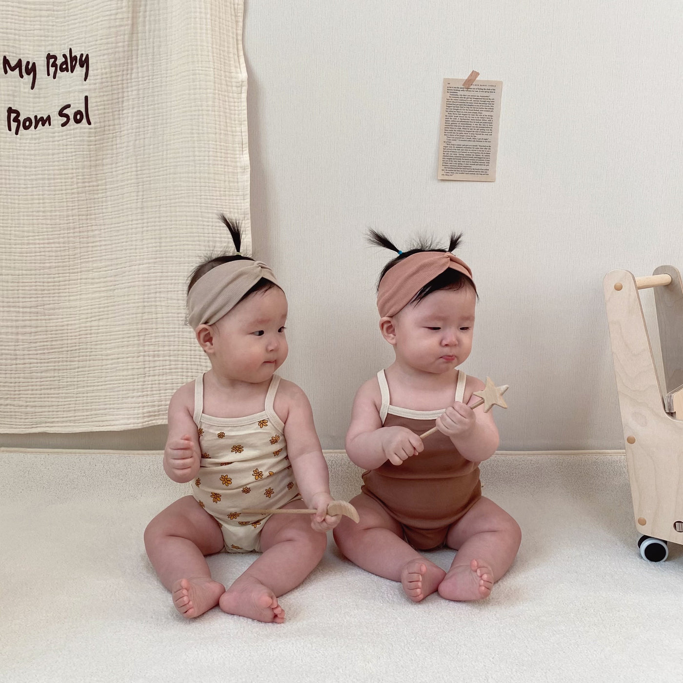 Babies wearing sleeveless tank bodysuit 