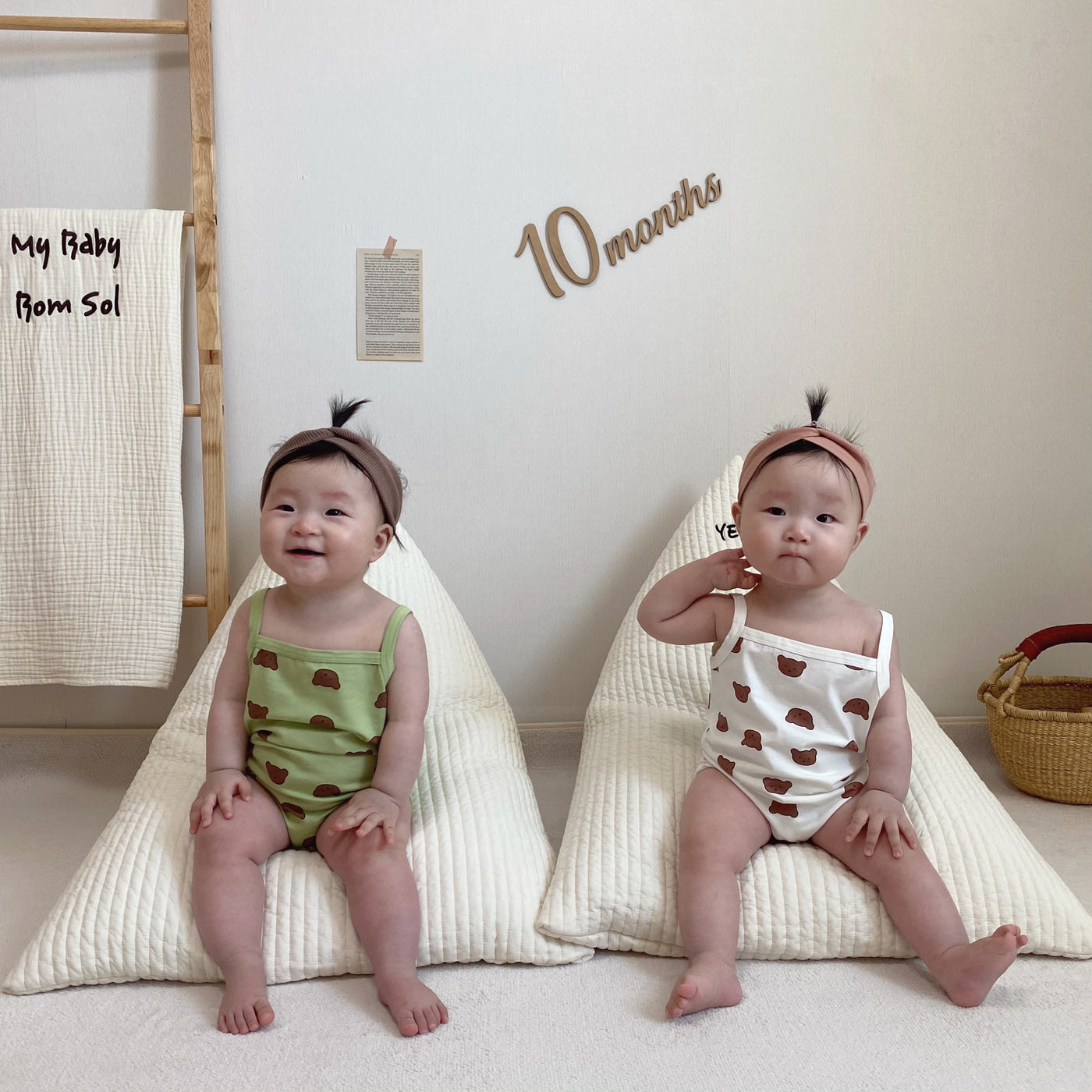 Babies wearing onesie with bear prints