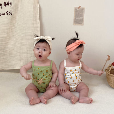 Babies wearing girl bodysuit in lemon prints