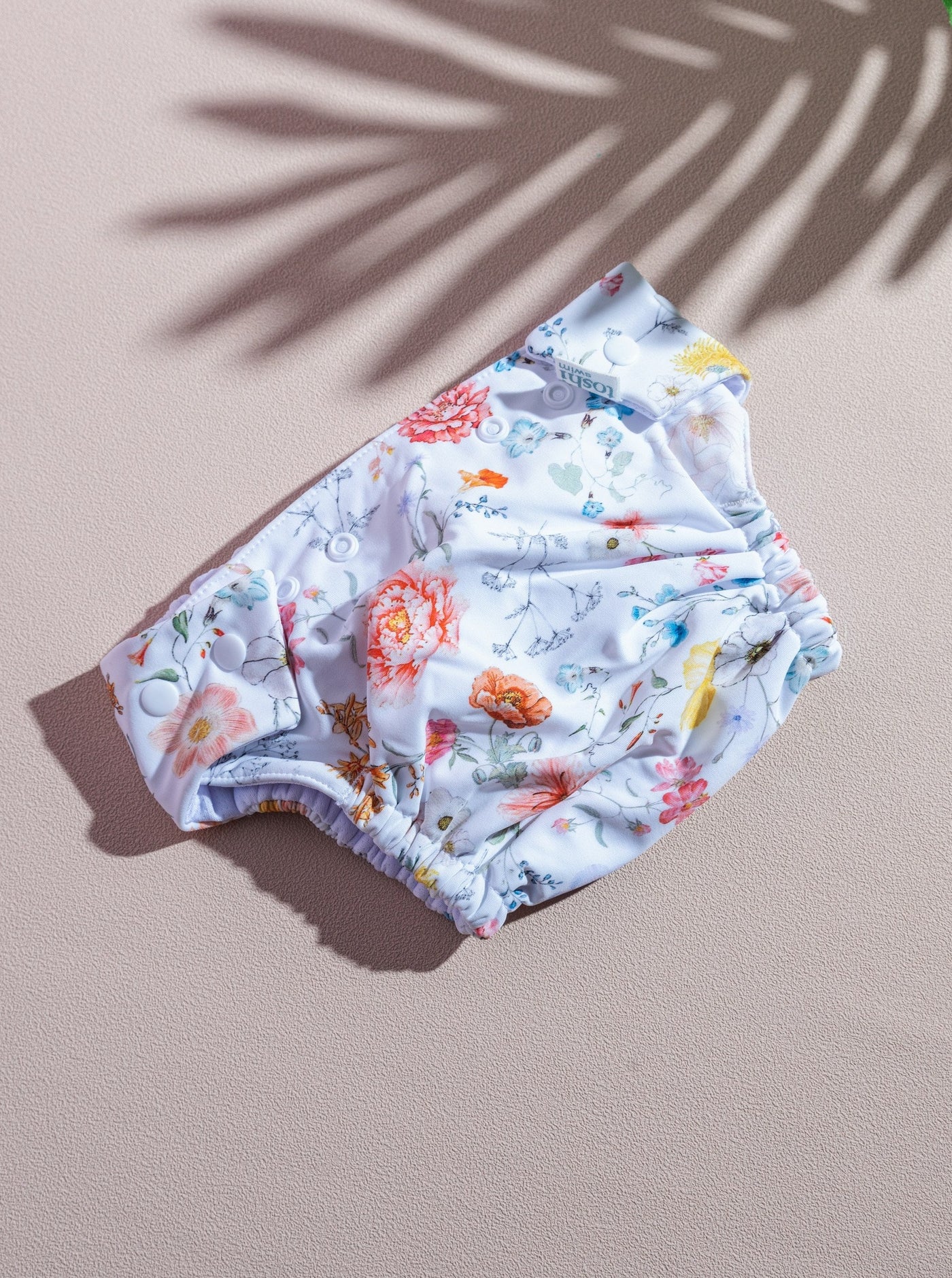 toshi baby rash guard and swim diapers in white floral prints