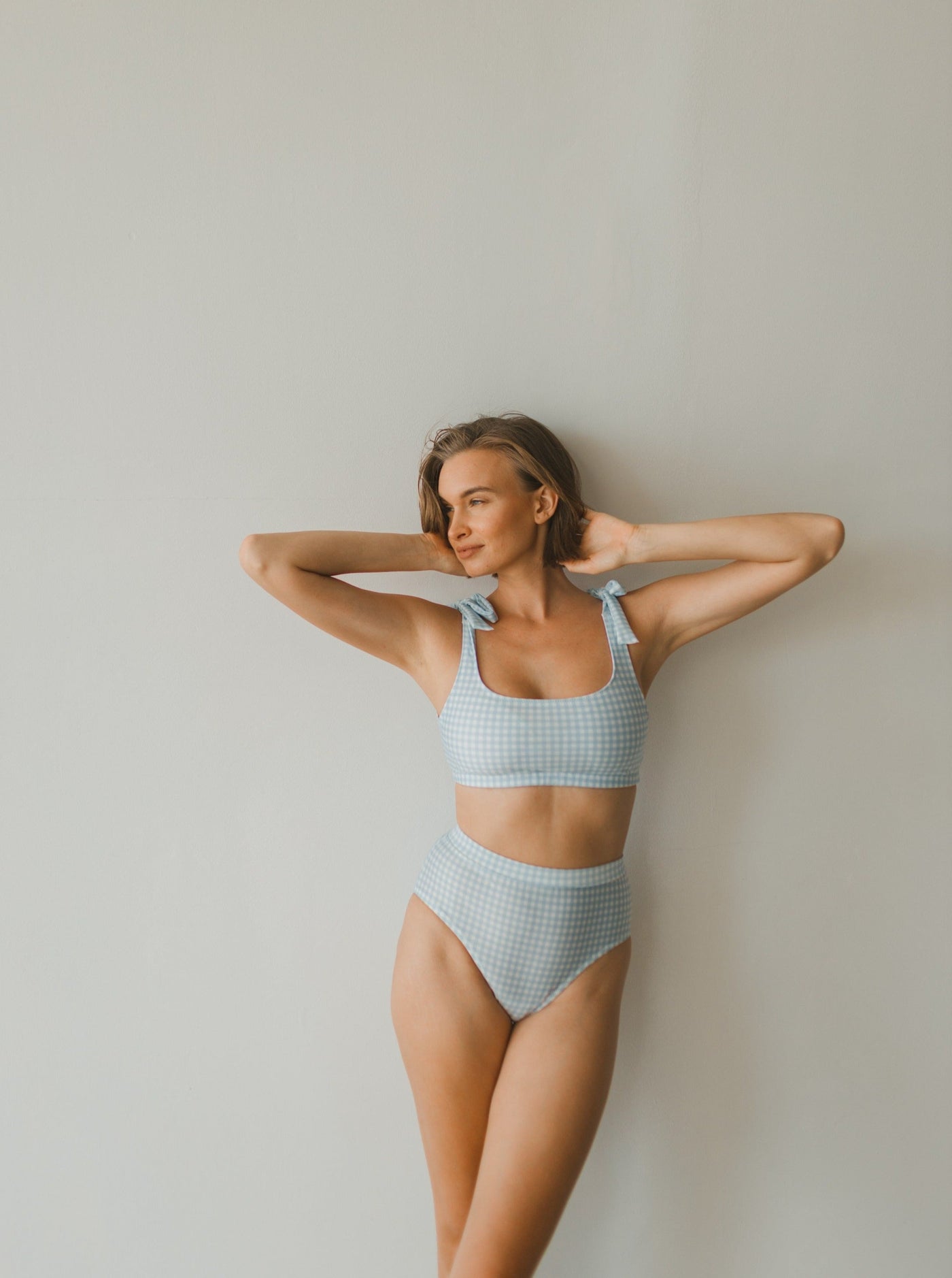 Woman two piece bikini swimwear in blue gingham prints