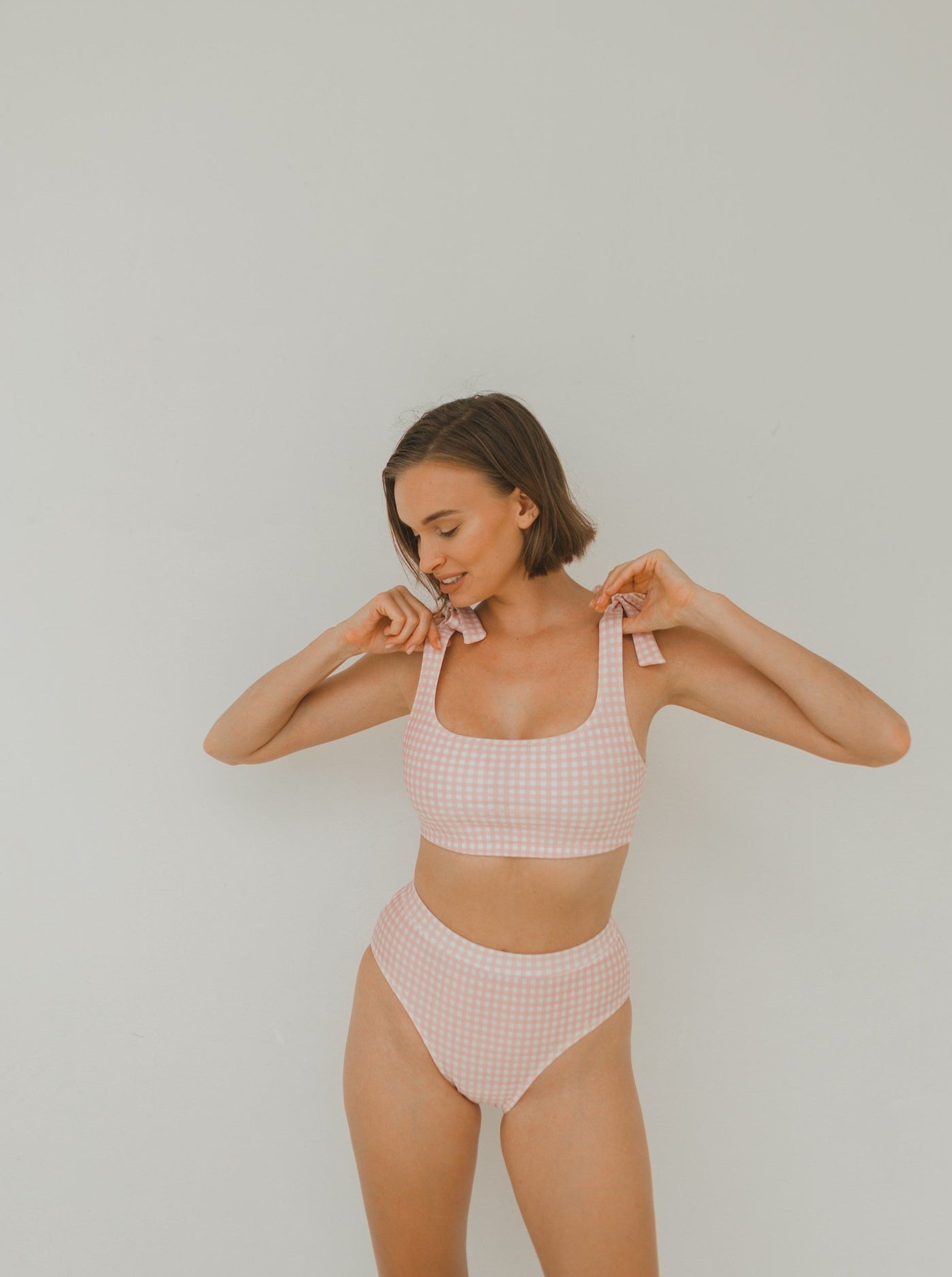 Woman two piece bikini swimwear in pink gingham prints
