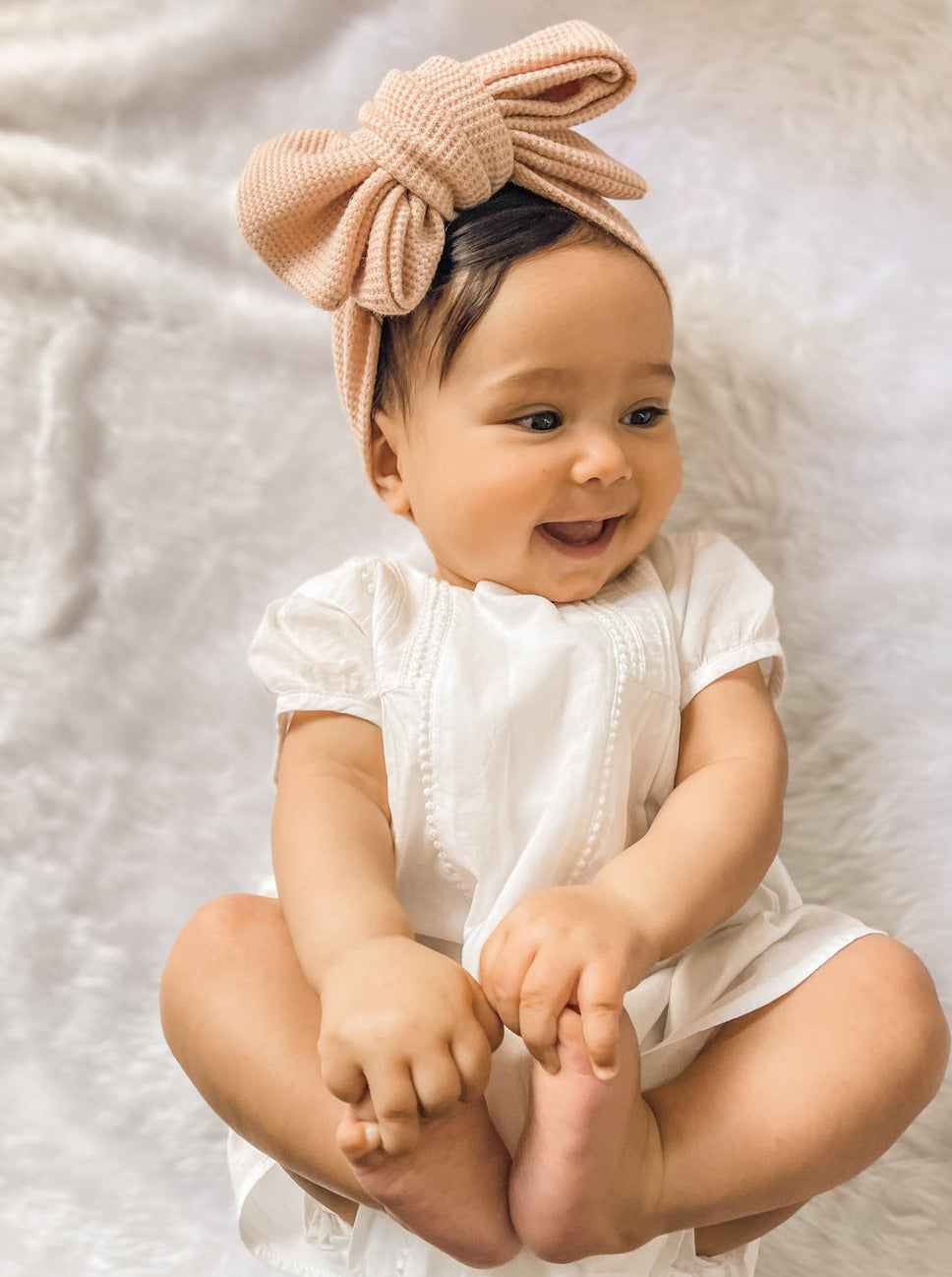 babies oversized bow headband in pink waffle fabric