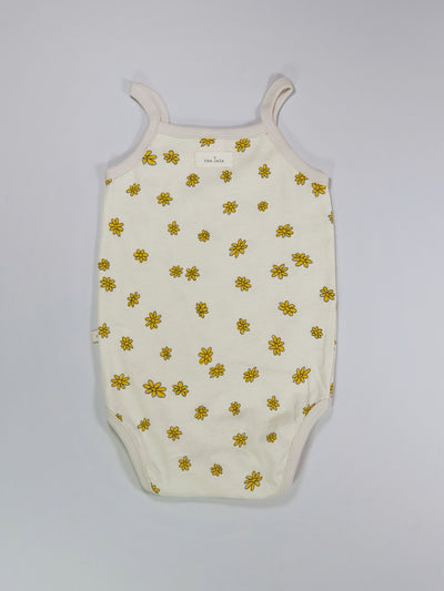 Baby girl bodysuit with floral prints in nude colour