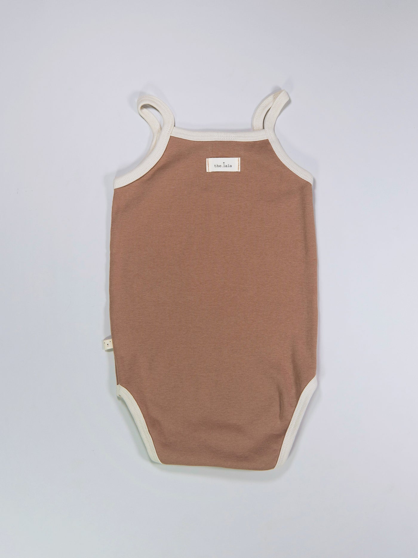 Baby sleeveless bodysuit in brick colour
