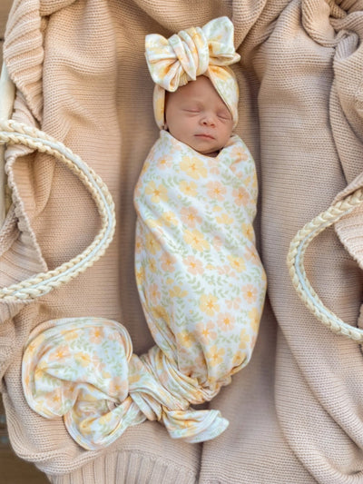 newborn jersey yellow floral swaddle and matching bow headband