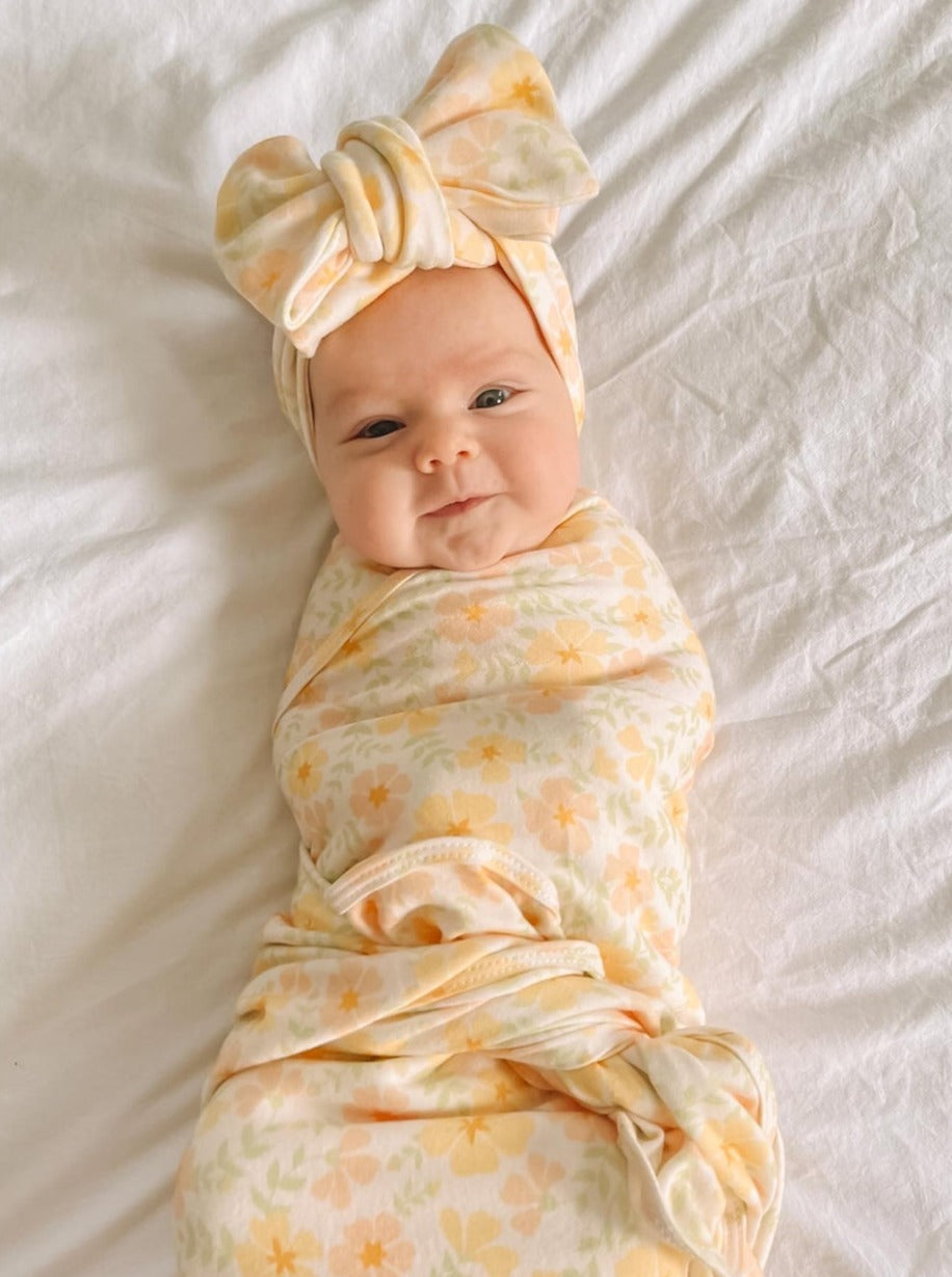 newborn jersey yellow floral swaddle and matching bow headband