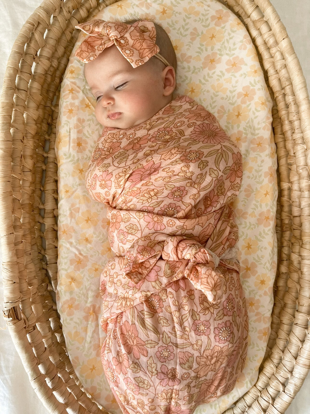 newborn peach floral swaddle with matching bow headband