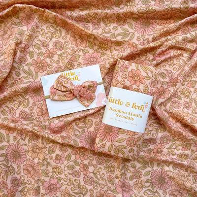 newborn peach floral swaddle with matching bow headband