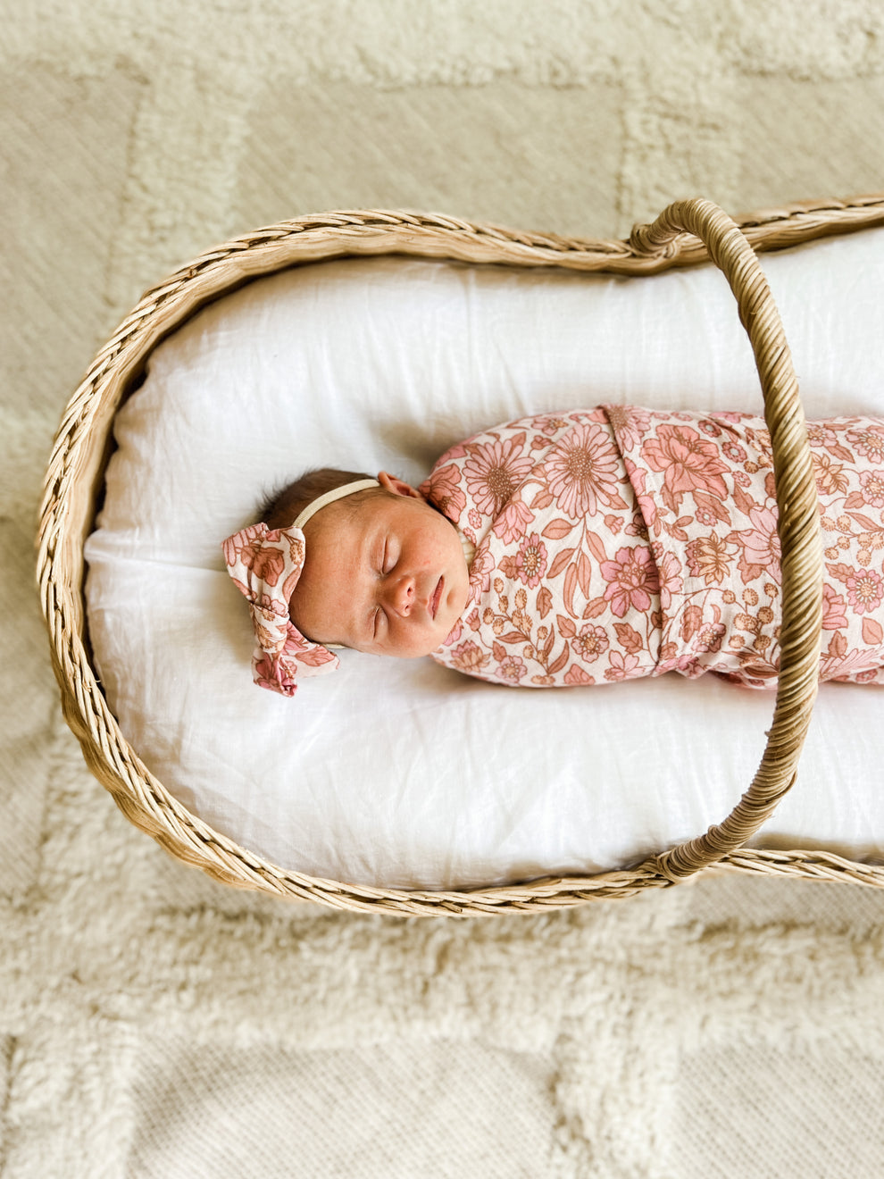 newborn muslin pink floral swaddle and matching bow headband